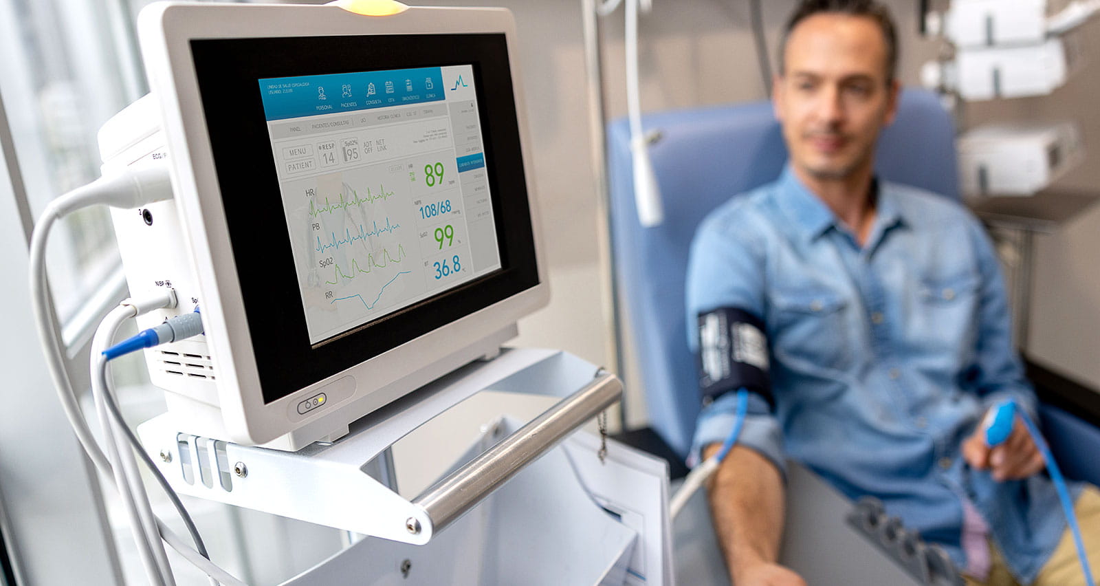 A patient's vital signs being monitored while receiving immunotherapy treatment