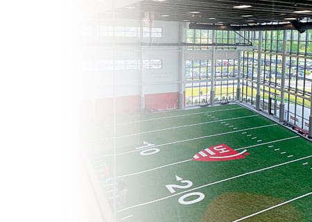 An overhead view of the indoor football field at UH Cutler Center for Men