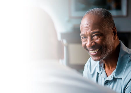Two older men in conversation
