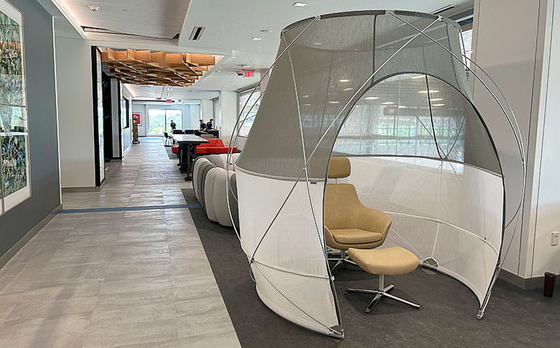 Comfortable seating surrounding a large screen for meditation and mindfulness practices at UH Cutler Center for Men