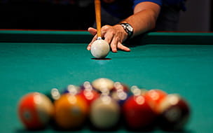 Young man playing pool