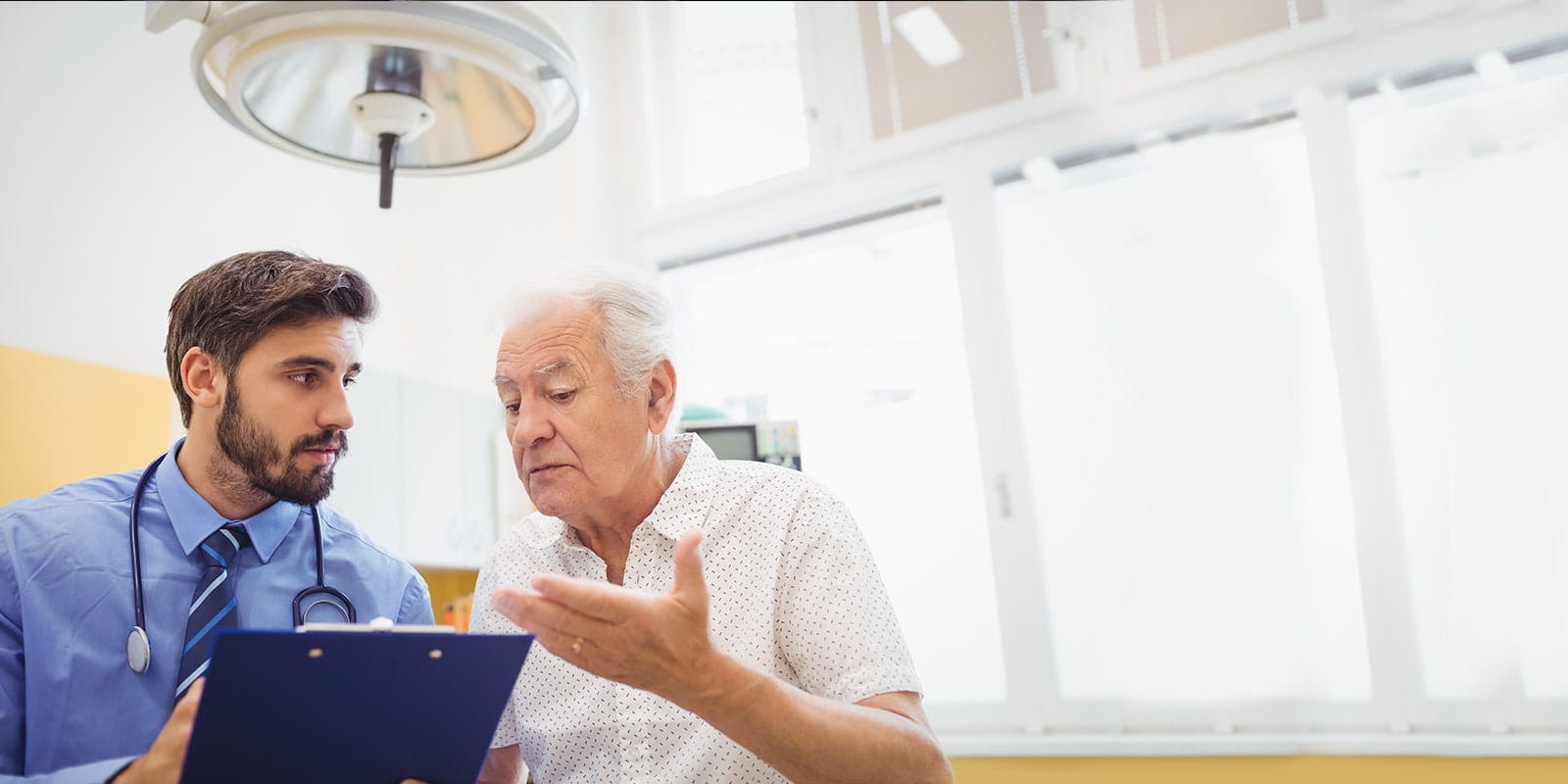 Doctor and patient discussing medical procedure.