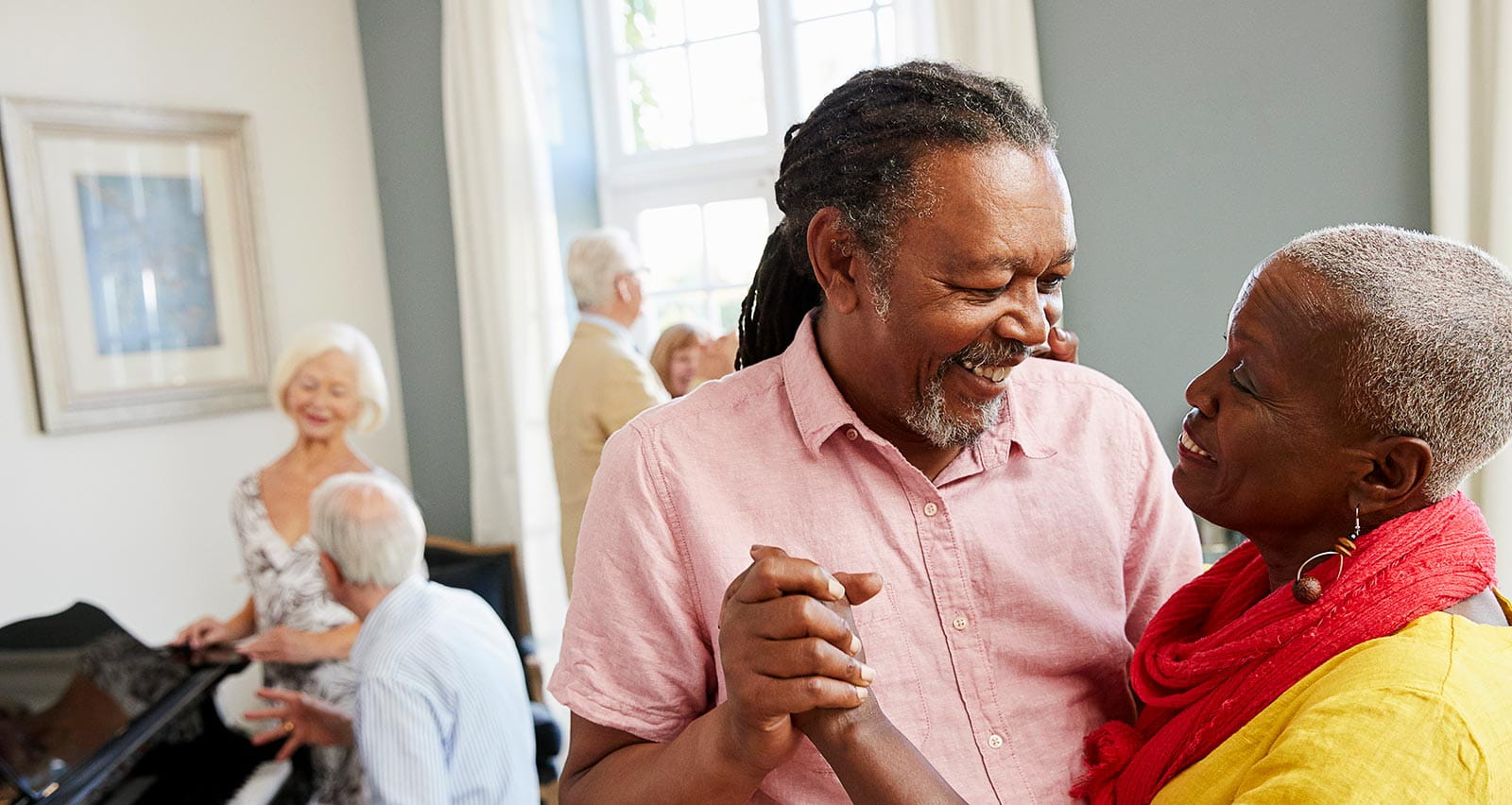 A group of seniors enjoying dancing together