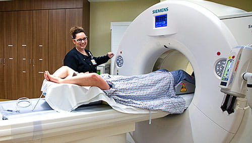 A patient enters the state-of-the-art Siemens Dual-Energy Scanner