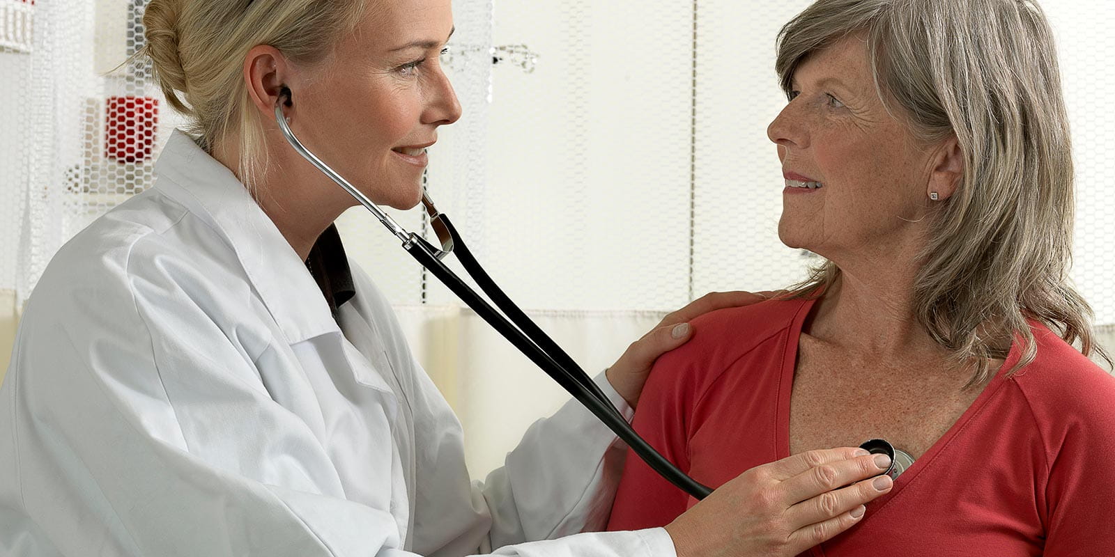 Cardio doctor examining mature woman