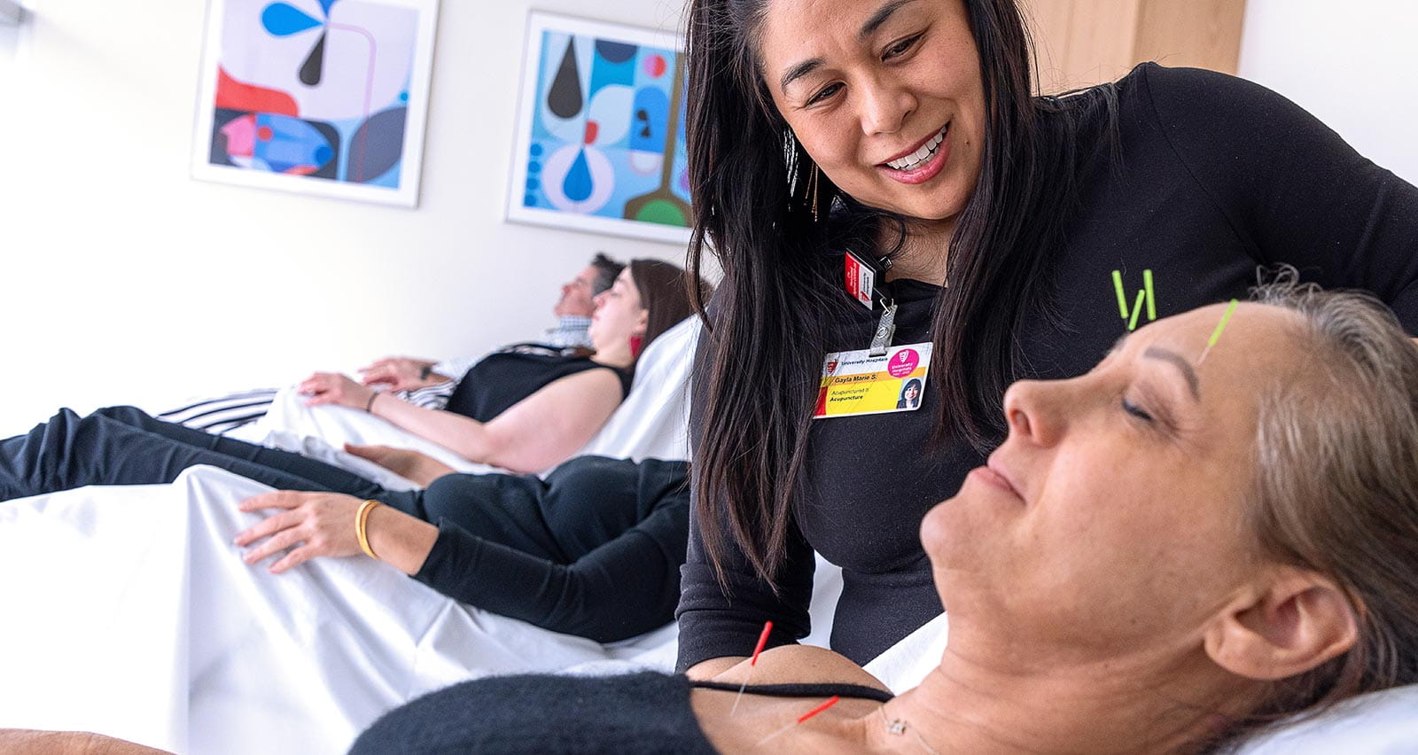 Acupuncturist Gayla Marie Stiles, MS, LAc tends to patient Stacy Edelstein