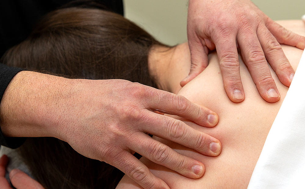 Carlos Gonzalez performs massage on a patient at UH Connor Whole Health in Beachwood