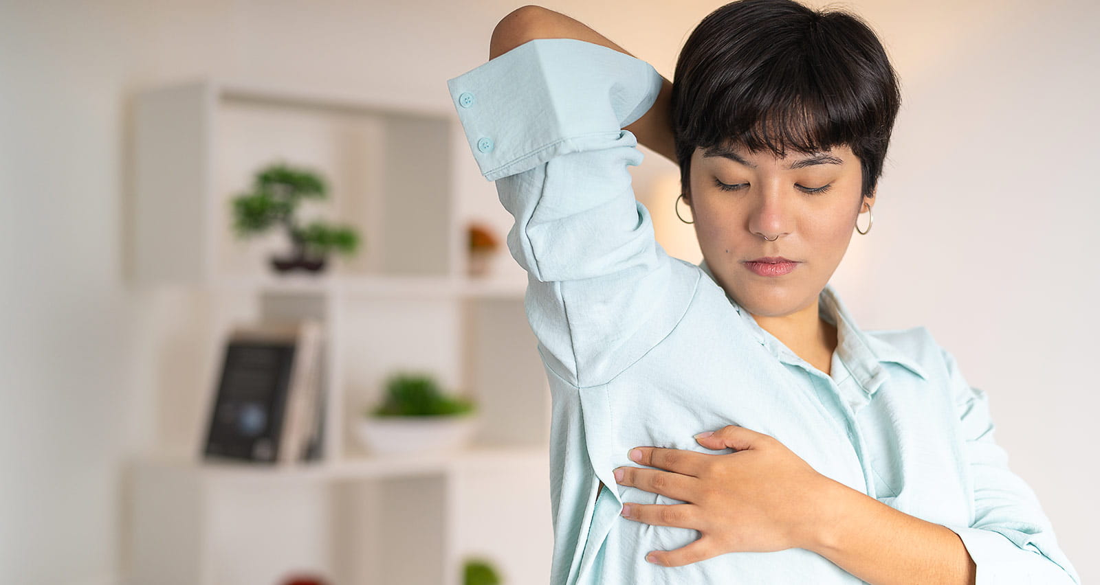 A woman examines her nipple