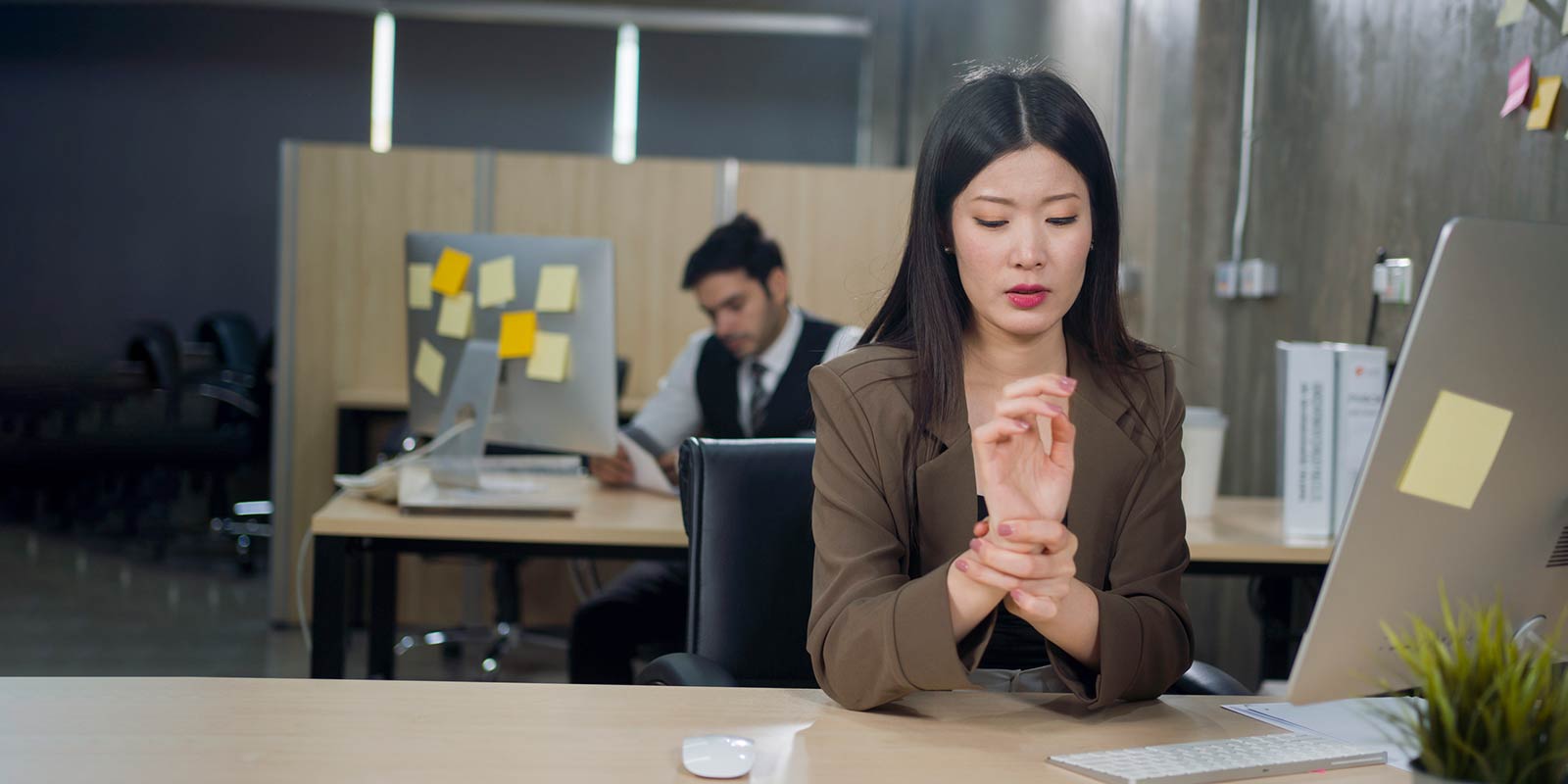 Woman feeling the strain on the tendons of her wrists