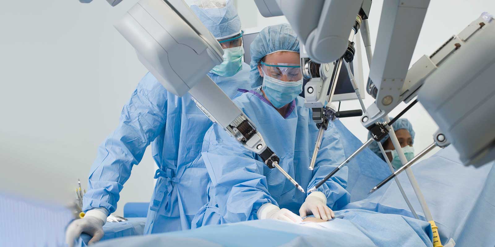 Surgeon in hospital with robot