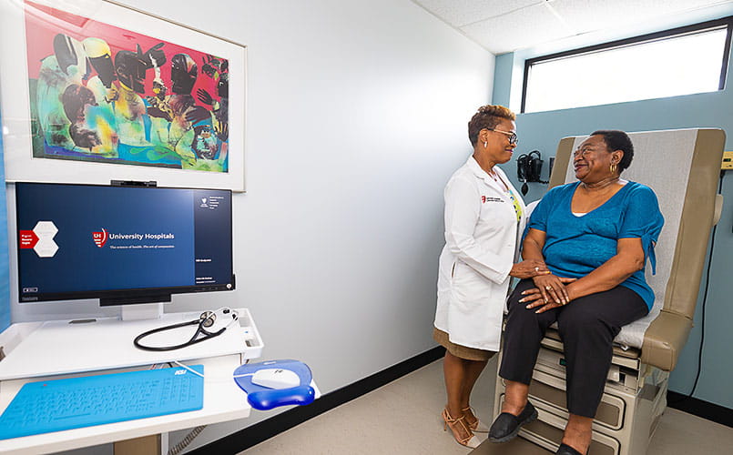 Carla Harwell MD treats a patient in the exam room
