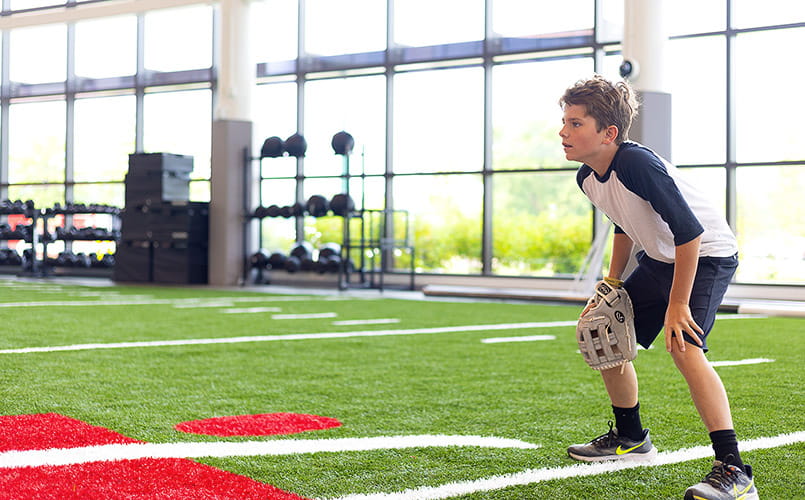 A young boy playing catch at Drusinsky Sports Medicine Institute at UH Ahuja Medical Center