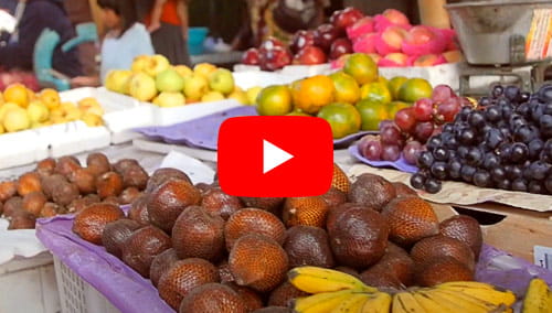 A fruit stand in an exotic locale