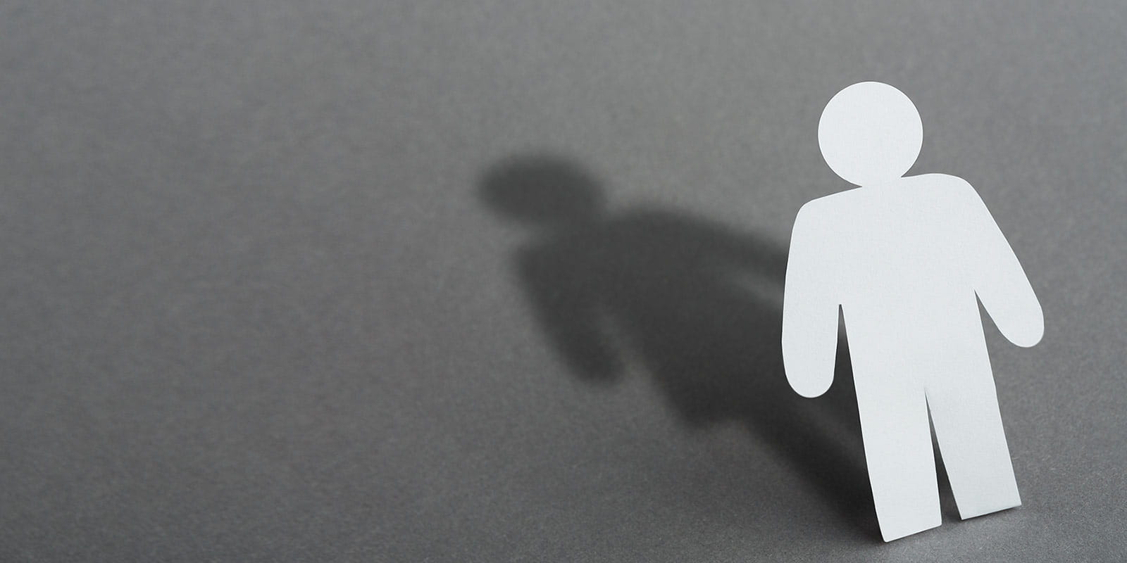 Shadow of cutout man in shape of woman